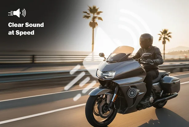 Rider on a touring motorcycle travels along a coastal road at sunset. Text reads "Clear Sound at Speed."